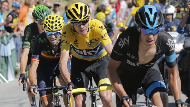 In front: Britain's Chris Froome, wearing the overall leader's yellow jersey, and Australia's Richie Porte, climb during the 20th stage of the Tour de France from Modane to Alpe d'Huez.