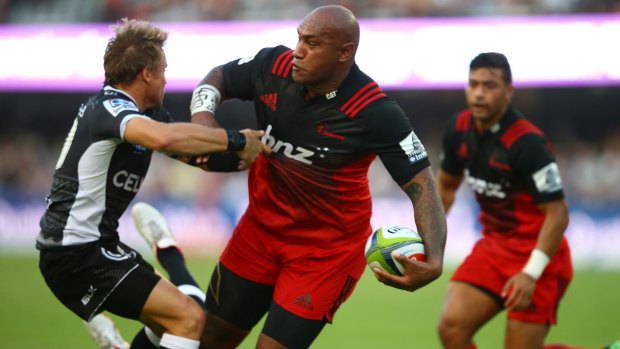 Heavyweight stoush: Nemani Nadolo tries to pass during the Super Rugby match between the Sharks and Crusaders at Kings Park in Durban.