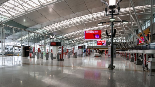 Travel restrictions have left Sydney Airport virtually empty in the lead up to Christmas - what is normally one of the busiest weeks of the year. 