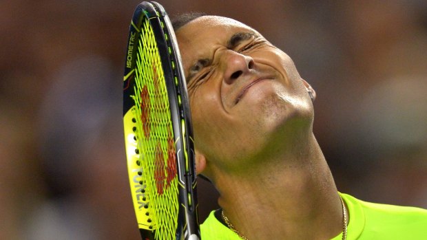 Kyrgios shows his disappointment after missing a point.
