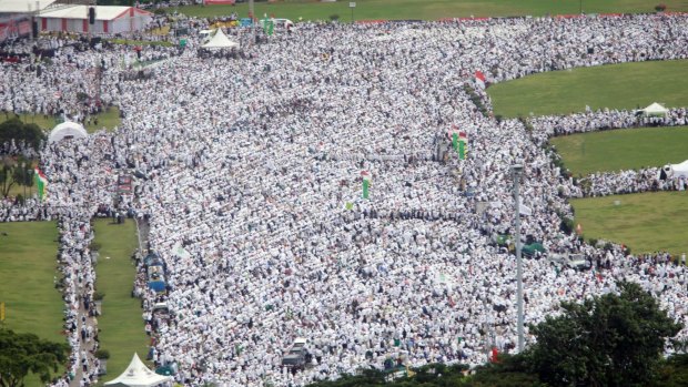 Indonesian Muslims gather at the National Monument in Jakarta during a rally against governor Basuki "Ahok" Tjahaja Purnama, who is being prosecuted for blasphemy.