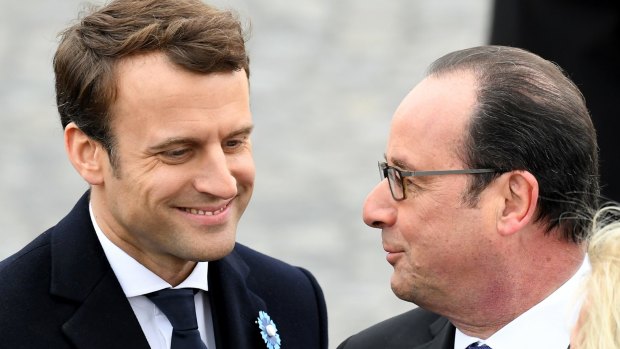 President-elect Emmanuel Macron and outgoing President Francois Hollande attend a ceremony to mark the Western allies' World War II victory in Europe at the Arc De Triumphe.