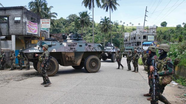 Government troops head to the frontline to fight Muslim militants in Marawi in May.