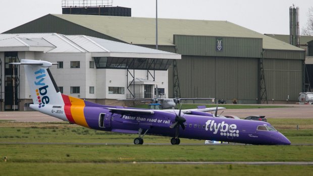 A Flybe plane on the tarmac at Belfast International Airport, in Northern Ireland, last month. The plane carrying more than 50 people made an emergency landing without its nose gear at Belfast International Airport. 