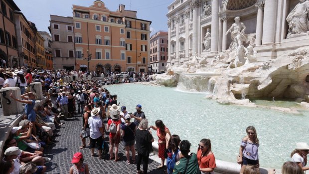 Tourists caught eating or dipping their feet at the Trevi Fountain face big fines.