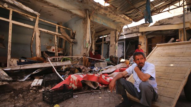 Locals inspect damage in parts of the historic district of  Diyarbakir last May.