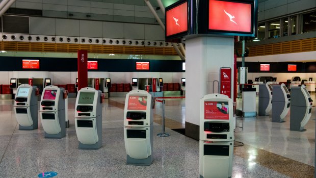 Sydney Airport's domestic terminal sits empty during the city's lockdown as other states close the borders.