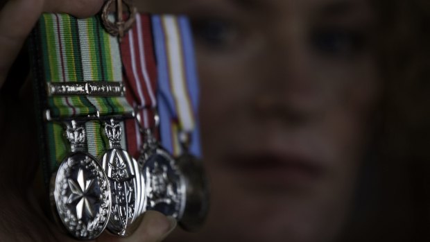 Bridget Clinch pictured in 2010 with the medals she was awarded for two tours of duty in East Timor.
