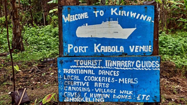 Hand painted tourist sign at Kiriwina Port Kaibola, Kiriwina Island.