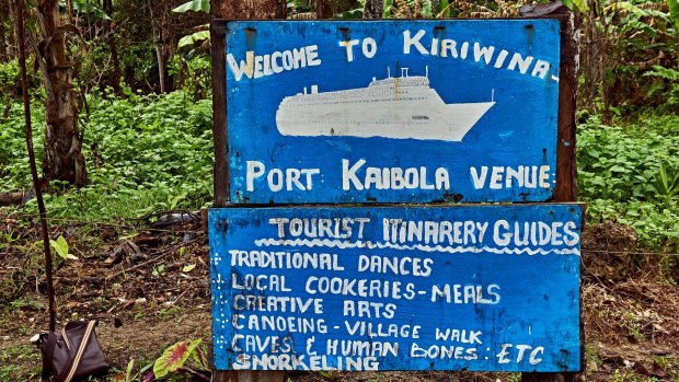 Hand painted tourist sign at Kiriwina Port Kaibola, Kiriwina Island.