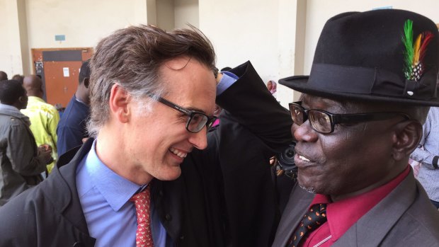 Civil party lawyer Alain Werner with former prisoner Souleymane Guengueng after the trial of Chad's former dictator Hissene Habre in Dakar on Monday. 