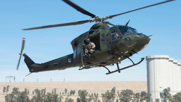 A Canadian Forces Griffon helicopter comes in for a landing near the Mosul dam in February.