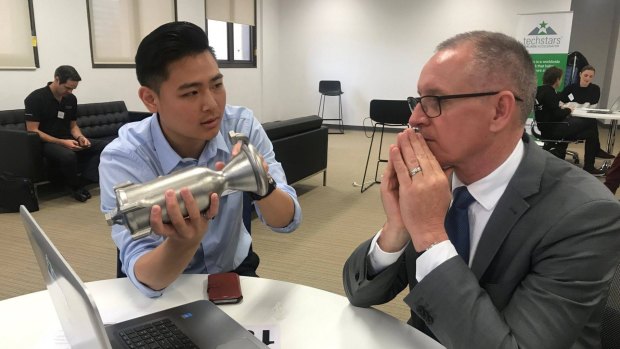 Andy Kieatiwong explains his next generation rockets to South Australian premier Jay Weatherill at TechStars in Adelaide.