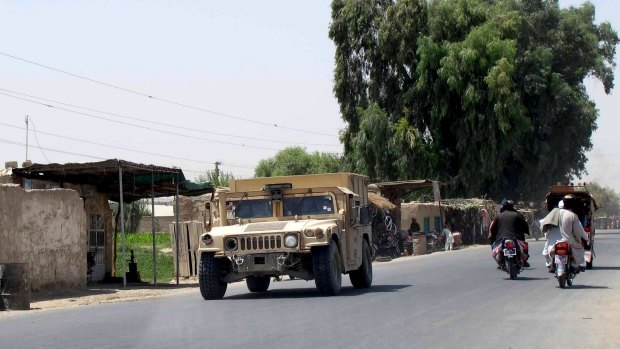 An Afghan armoured police vehicle patrolling in Lashkar Gah capital of Helmand province on Wednesday.