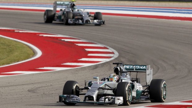 A one-two finish: Lewis Hamilton leads teammate Nico Rosberg during the US Grand Prix.