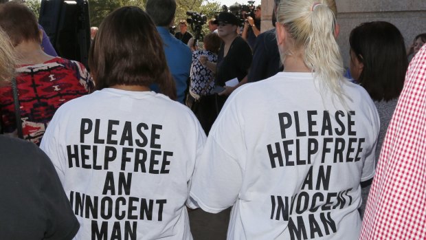 Ericka Glossip-Hodge, left, daughter of Richard Glossip, and Billie Jo Ogden Boyiddle, right, Richard Glossip's sister, listen during a rally to stop the execution of Richard Glossip, in Oklahoma City, on Tuesday. 