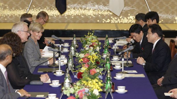 Australian Foreign Minister Julie Bishop, fourth from left, talks with her Japanese counterpart Fumio Kishida, right, at Foreign Ministry's Iikura Guesthouse in Tokyo on Monday.