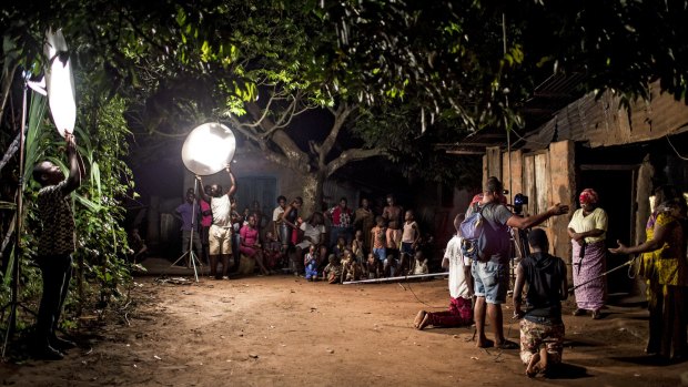 Lights for a Nollywood night scene are powered by portable generators in Nigeria.