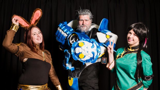 Some Gamma.con goers spent months on their outfits. From left, Maddison Turner as Velvet Scarlatina, Chris Schofield as Reinhardt, and Taylor Hogan as Lie Ren.