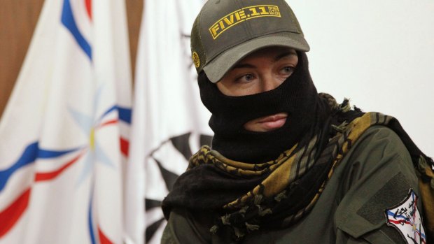 A foreign female fighter who has joined the Assyrian militia Dwekh Nawsha in Dohuk, northern Iraq. Assyrian communities are being targeted as Islamic State fights the Dwekh Nawsha and Kurdish militias in Syria's north-east.