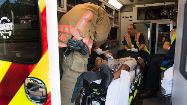 Medics resuscitate a victim of an auto accident who overdosed on heroin, in Colerain.