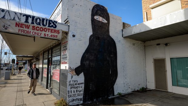 A mural of Hillary Clinton in West Footscray that was originally of her in a bikini has been painted over with her now in a niqab.