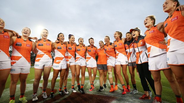 Giants players celebrate victory following the round five AFL Women's match between the Greater Western Sydney Giants and the Melbourne Demons. 