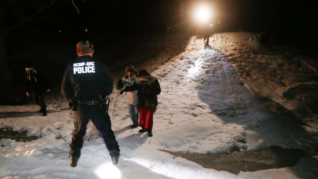 Migrants from Somalia are arrested and detained by RCMP after crossing into Canada illegally.