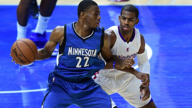 Future force: No.1 draft pick Andrew Wiggins posts up for Minnesota against Clippers veteran Chris Paul.