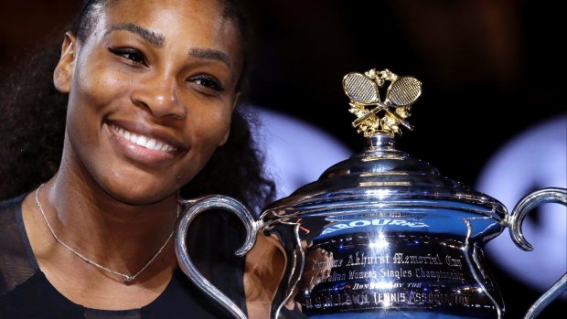 Serena Williams holds her trophy after defeating her sister Venus at the 2017 Australian Open.