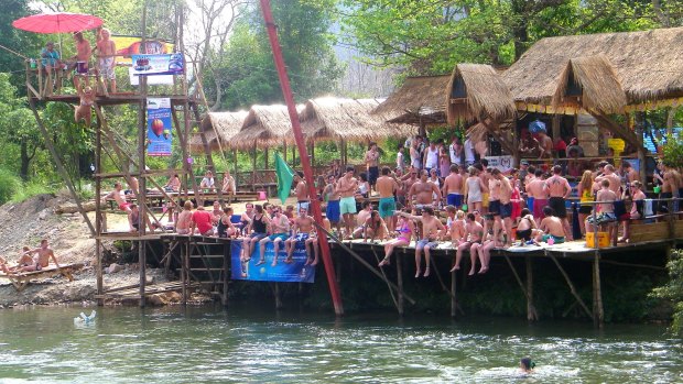 Australian tourists at the now deserted riverside bars in Vang Vieng.