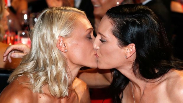 Erin Phillips (left) kissing wife Tracy Gahan after Phillips was named the inaugural AFLW player of the year.