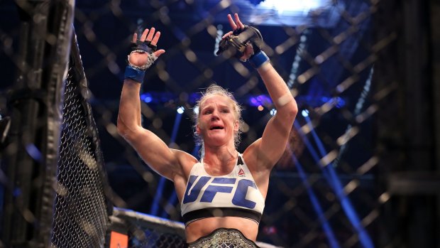 Feeling better than fine: Holly Holm celebrates victory over Ronda Rousey during UFC 193.