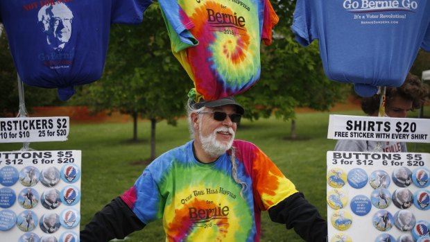 A vendor sells merchandise outside a campaign event for Senator Bernie Sanders in Louisville, Kentucky on Tuesday.