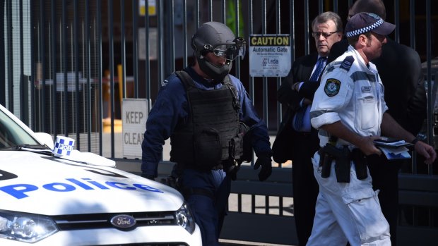 Officers from the bomb squad attend NSW Parliament House after reports of a suspicious package found near the building.