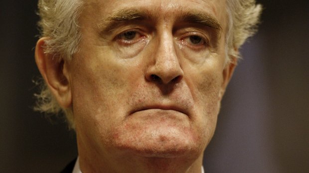 Former Bosnian Serb leader Radovan Karadzic stands in the courtroom during his initial appearance in 2008 at the UN's Yugoslav war crimes tribunal in The Hague. 