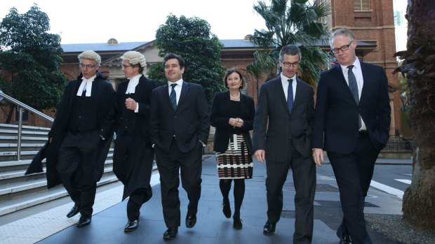 Barristers Tom Blackburn SC and Sandy Dawson, reporters Linton Besser and Kate McClymont, SMH editor-in-chief Darren Goodsir and state political editor Sean Nicholls  outside the Supreme Court.