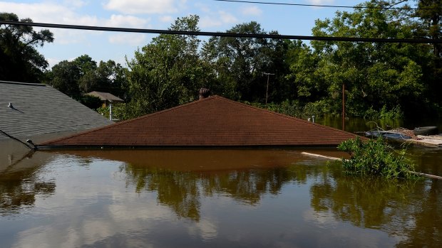 A house is flooded in the north end of Beaumont, Texas, on Thursday.