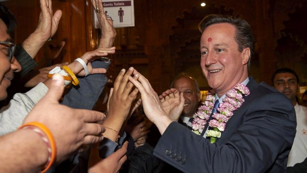 British Prime Minister and Conservative Party leader David Cameron visits the Neasden Hindu temple in London on Saturday while on the campaign trail.