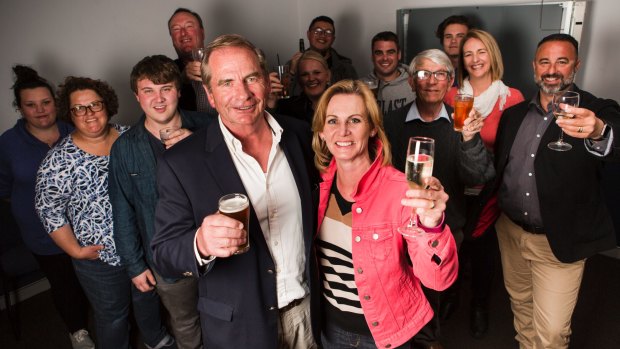 Former Queanbeyan Mayor Tim Overall celebrates on election night with wife Nichole and his team.
