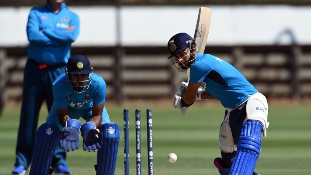Virat Kohli gets set to drive during a practice session at the Junction Oval in Melbourne on Friday.
