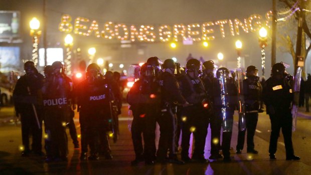 Police gather on the street in Ferguson.
