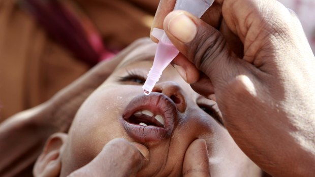 A newly arrived Somali refugee child given a polio vaccine in Kenya in 2011.