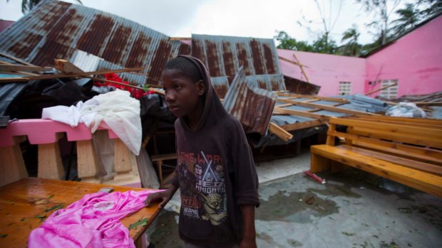A boy stands in a church after it was damaged by Hurricane Matthew in Saint-Louis, Haiti, on Wednesday.