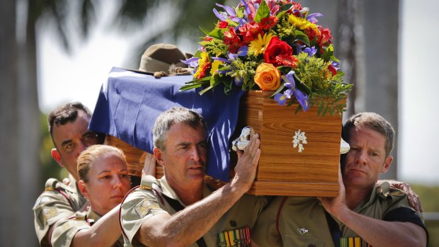 An Australian Army bearer party carries the coffin of the late Major General 'Digger' James during the funeral service at Pinaroo Cemetery in Brisbane's north. 