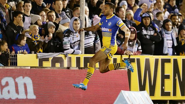 On the hop: Bevan French celebrates scoring a try against Cronulla Sharks in round 17.