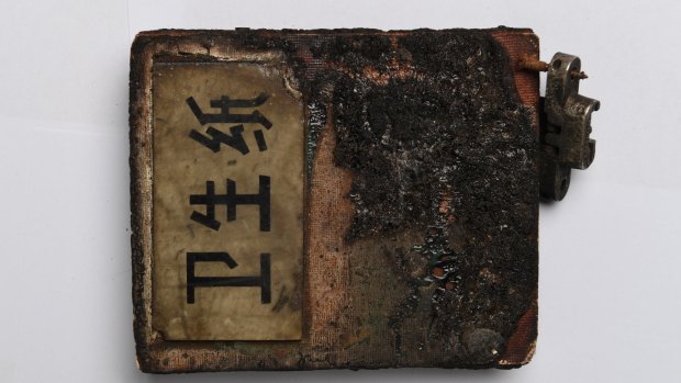 Toilet paper holder sign recovered from the 1971 plane crash in Mongolia that allegedly killed Mao's No. 2 Lin Biao.