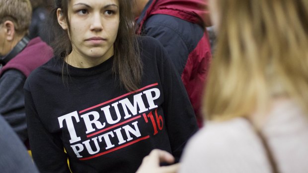 A woman wears a shirt reading "Trump Putin '16" while waiting for Republican presidential candidate Donald Trump at Plymouth State University.