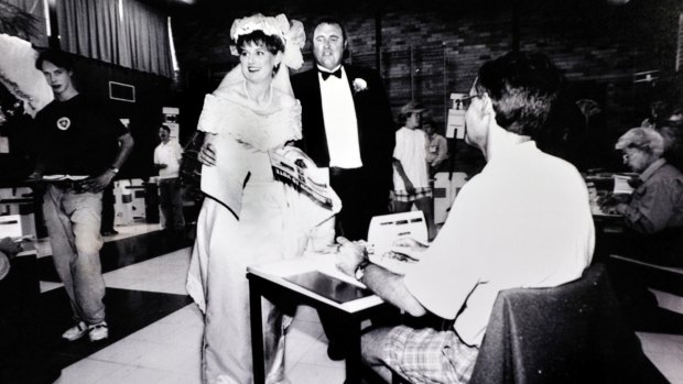 Bec Cody with father Tim, prepares to vote at the Mount Neighbour Primary school on her way to her wedding in 1996.