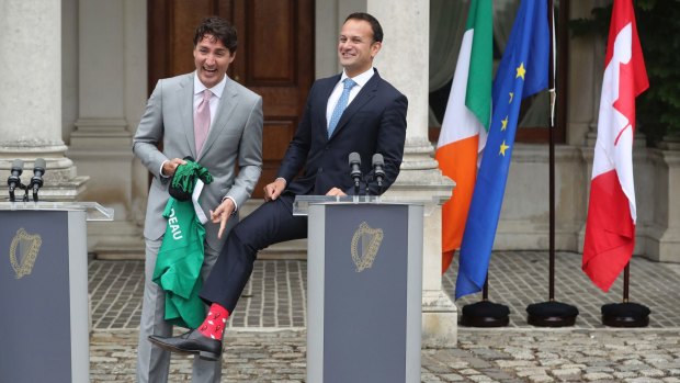 Upstaged: Irish prime minister Leo Varadkar, right, shows off his Canadian themed socks during a press conference with Canadian Prime Minister, Justin Trudeau.